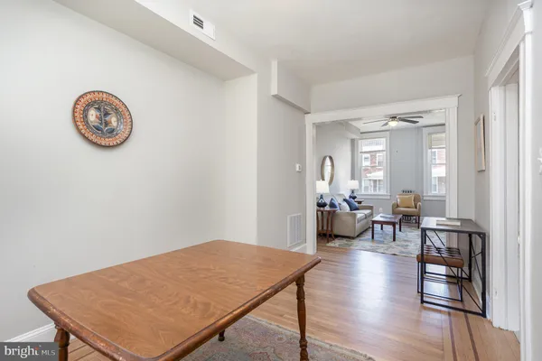 a view of a livingroom with furniture and wooden floor