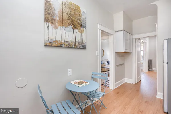 a view of a dining room with furniture and wooden floor