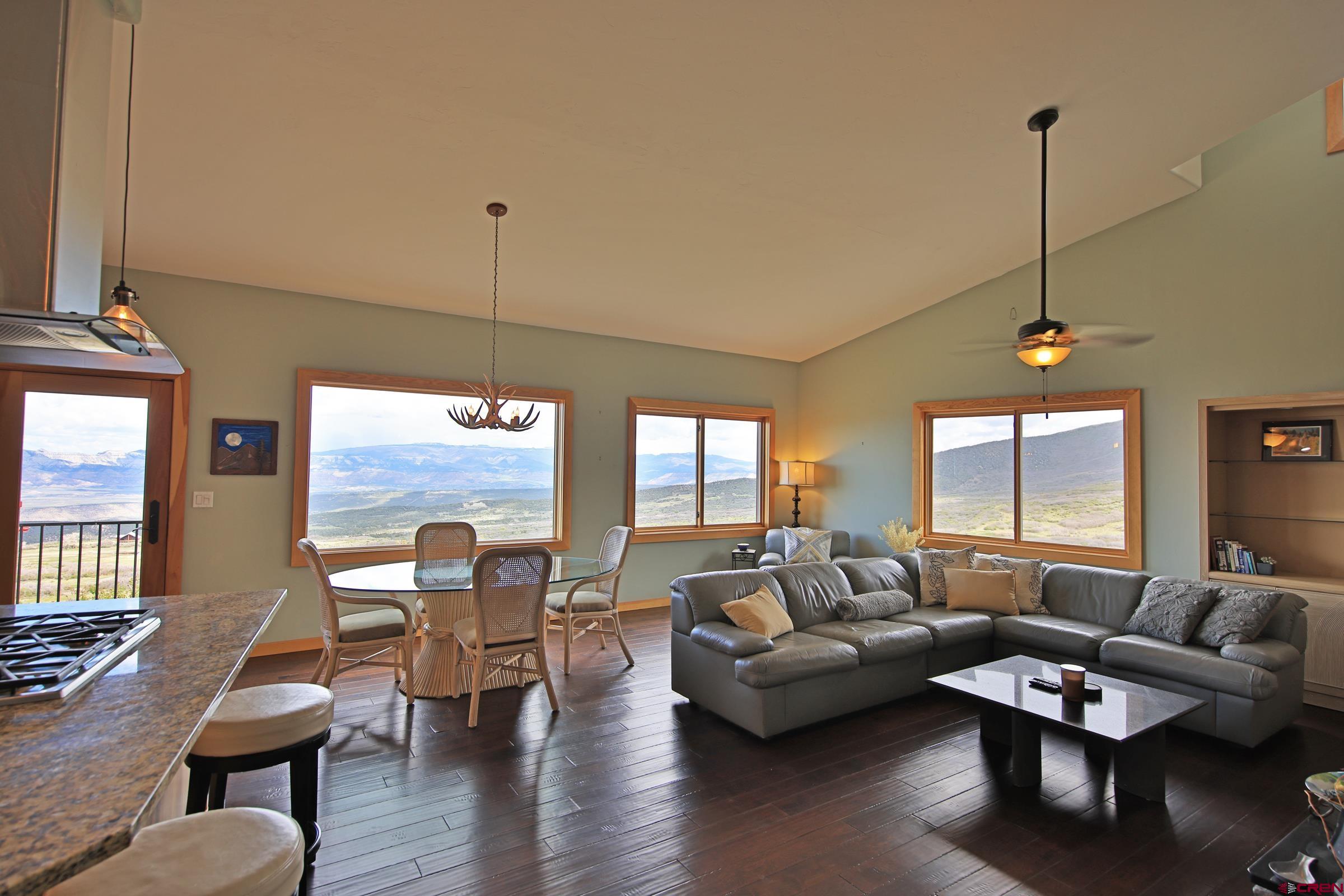 53315 Bull Basin Road Mesa, CO 81643 - Photo 15 of 44 a living room with furniture and wooden floor