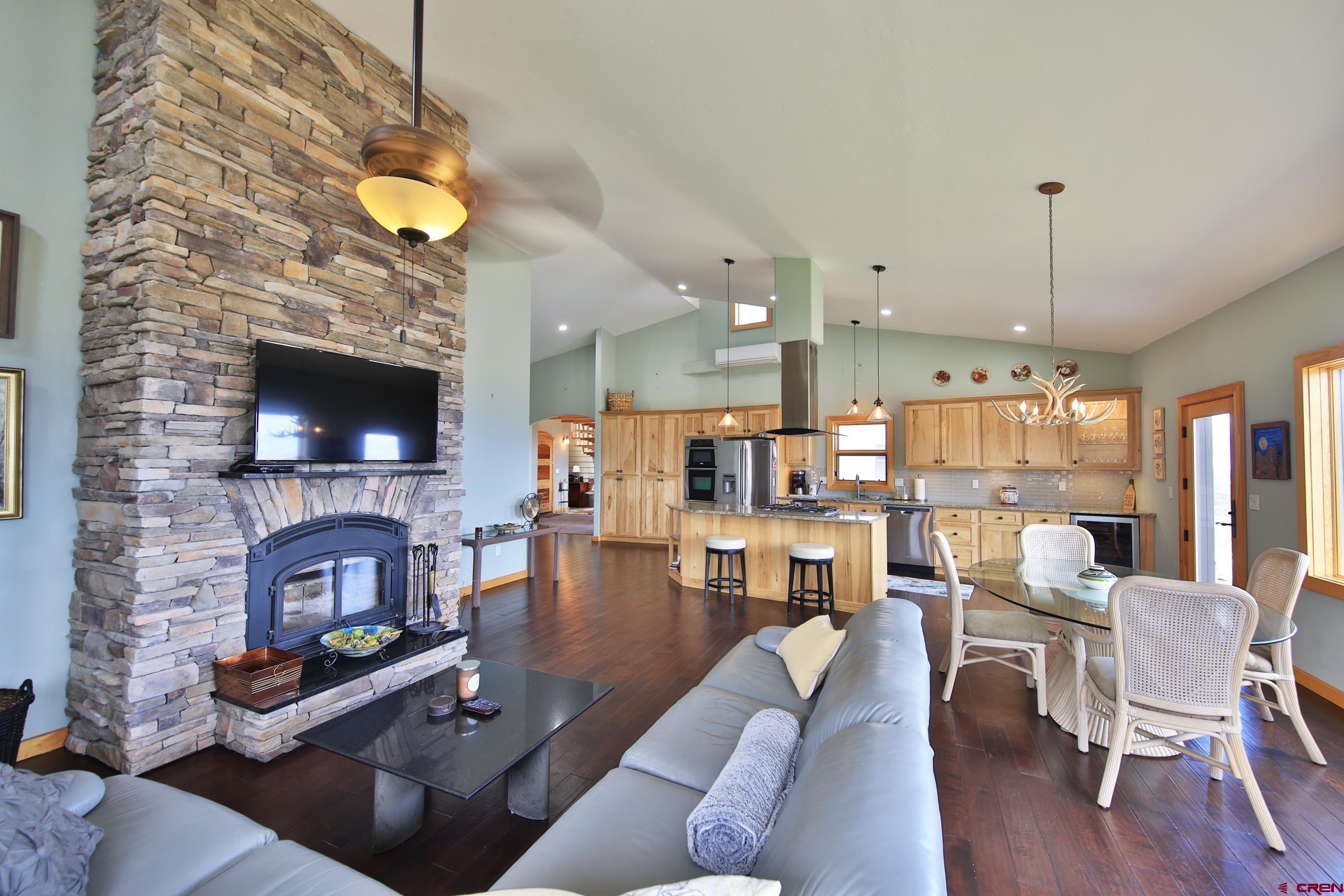 53315 Bull Basin Road Mesa, CO 81643 - Photo 17 of 44 a living room with furniture and a flat screen tv