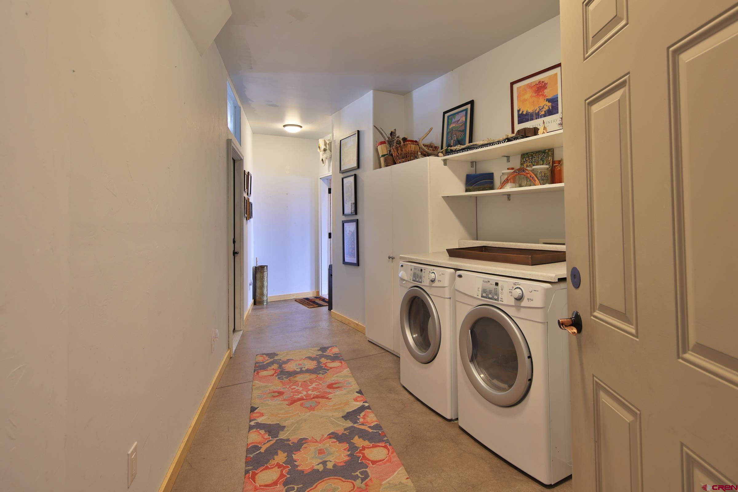 53315 Bull Basin Road Mesa, CO 81643 - Photo 21 of 44 a utility room with dryer and washer