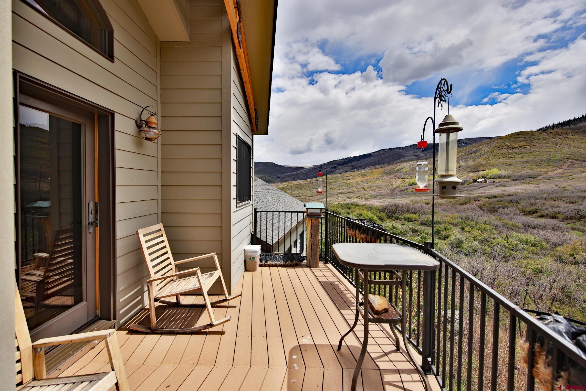 53315 Bull Basin Road Mesa, CO 81643 - Photo 36 of 44 a balcony view with a ocean view