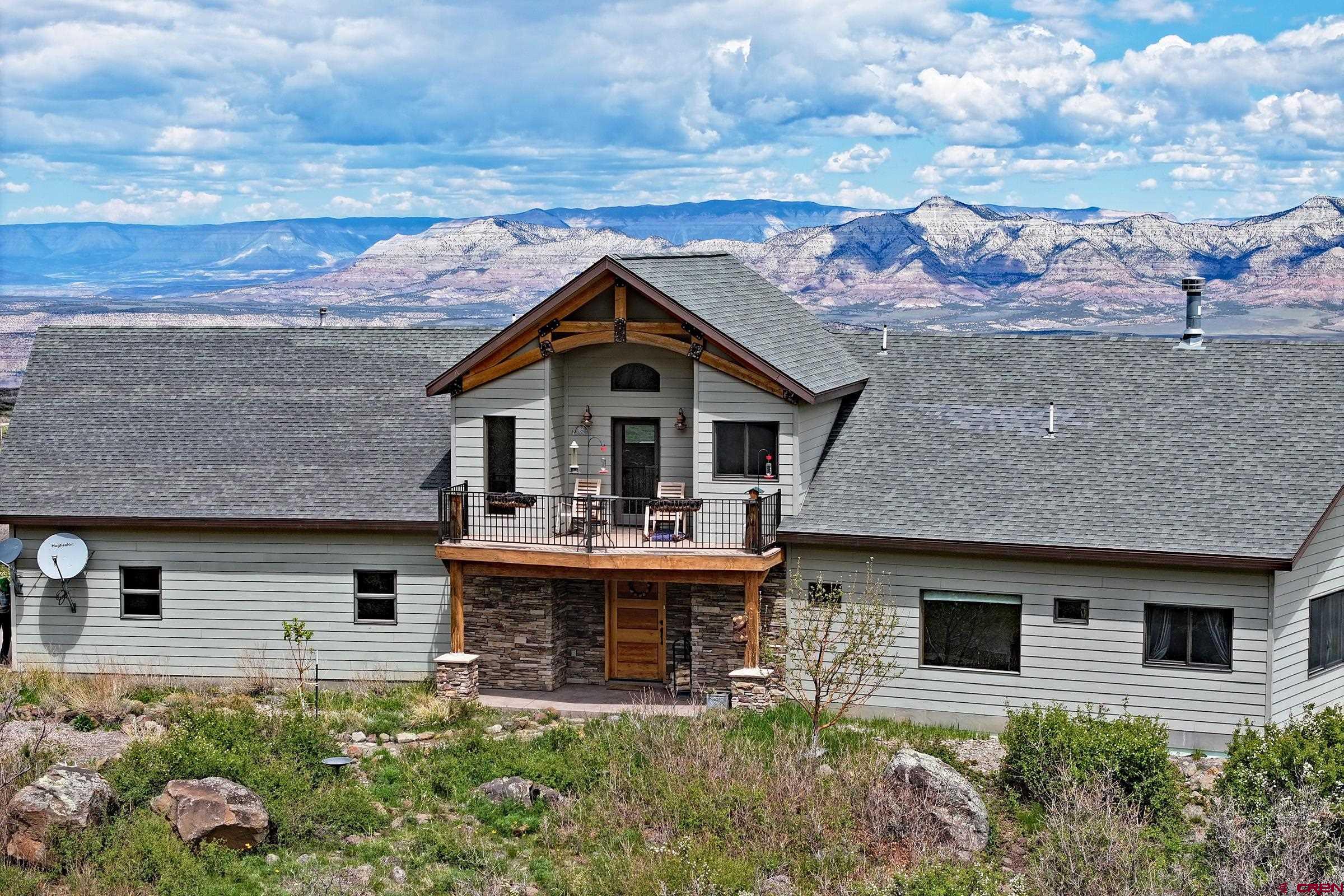 53315 Bull Basin Road Mesa, CO 81643 - Photo 4 of 44 a front view of a house with garden