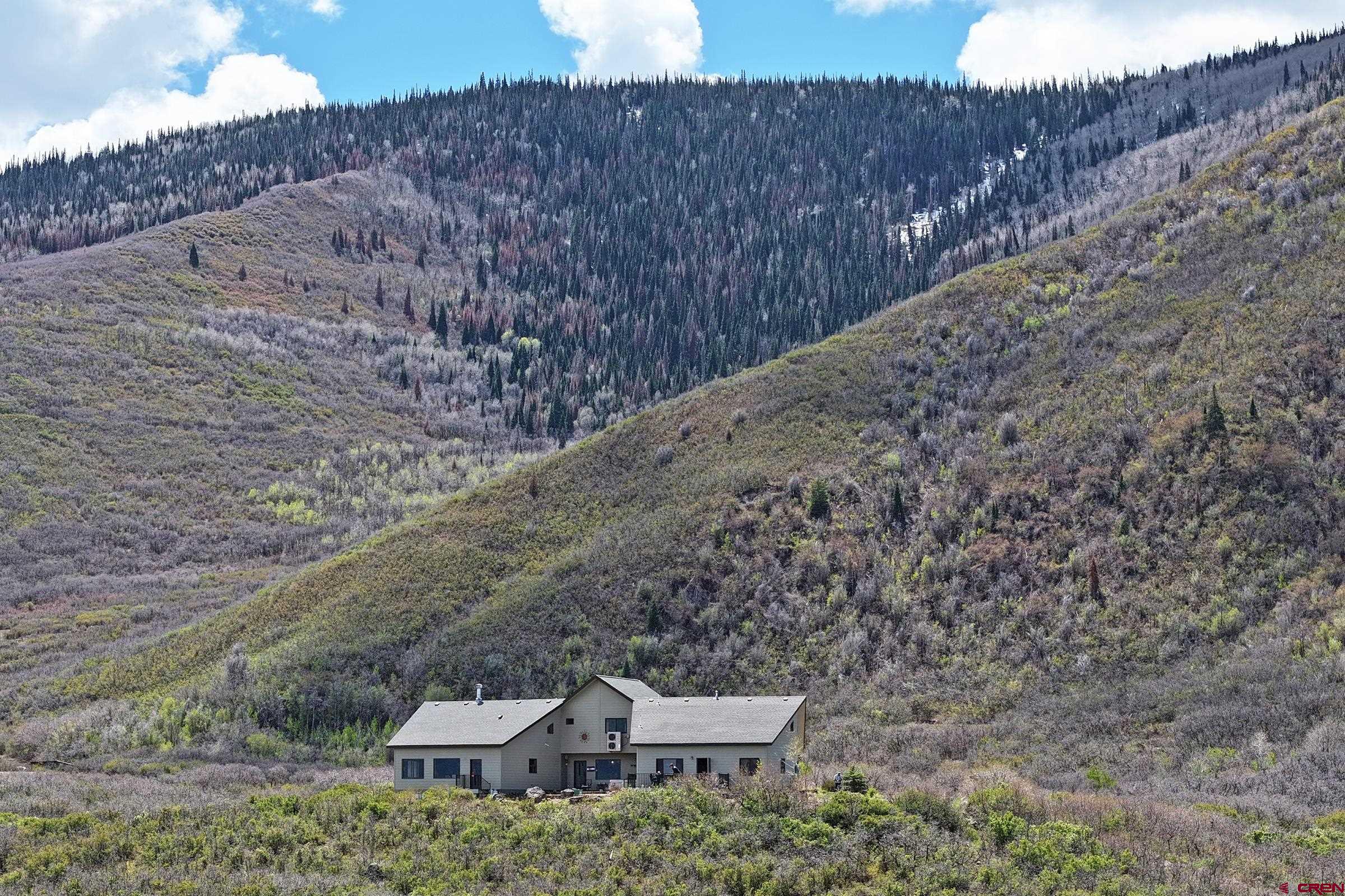 53315 Bull Basin Road Mesa, CO 81643 - Photo 41 of 44 a backyard of a house with a yard