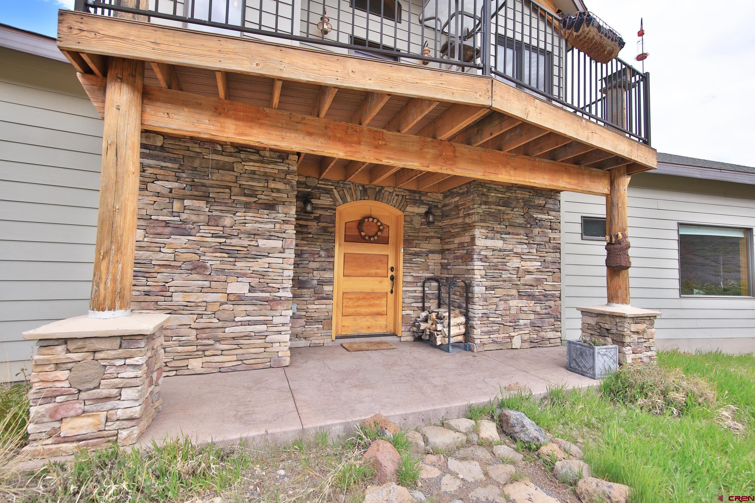 53315 Bull Basin Road Mesa, CO 81643 - Photo 9 of 44 a front view of a building with garden