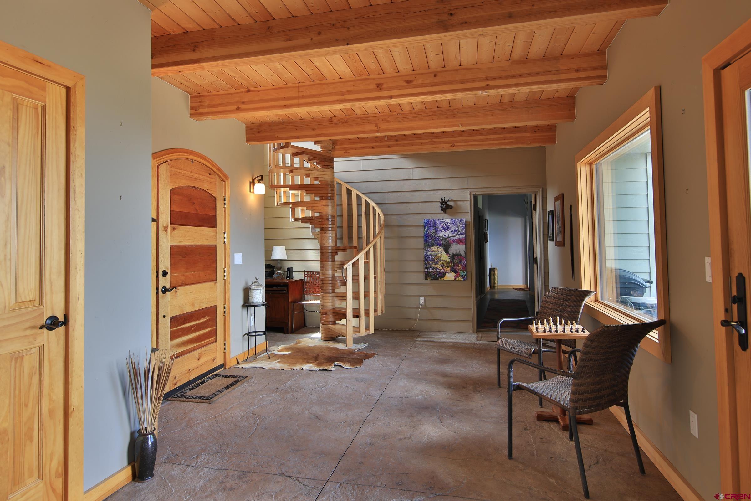 53315 Bull Basin Road Mesa, CO 81643 - Photo 10 of 44 a view of a hallway with seating area