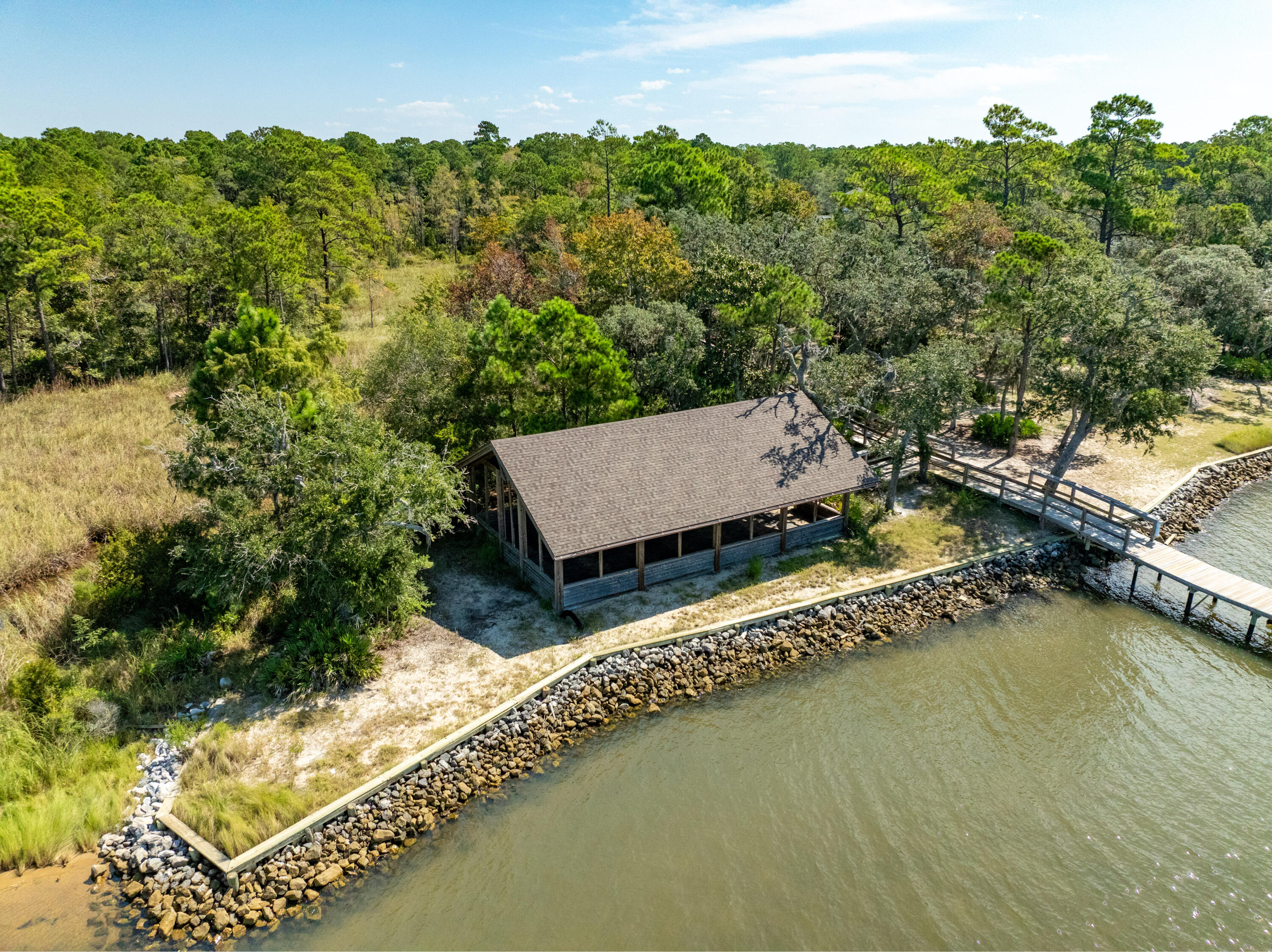 Lot 37 East Captain Fritz Way Freeport, FL 32439 - Photo 11 of 34 an aerial view of a house with a garden and trees