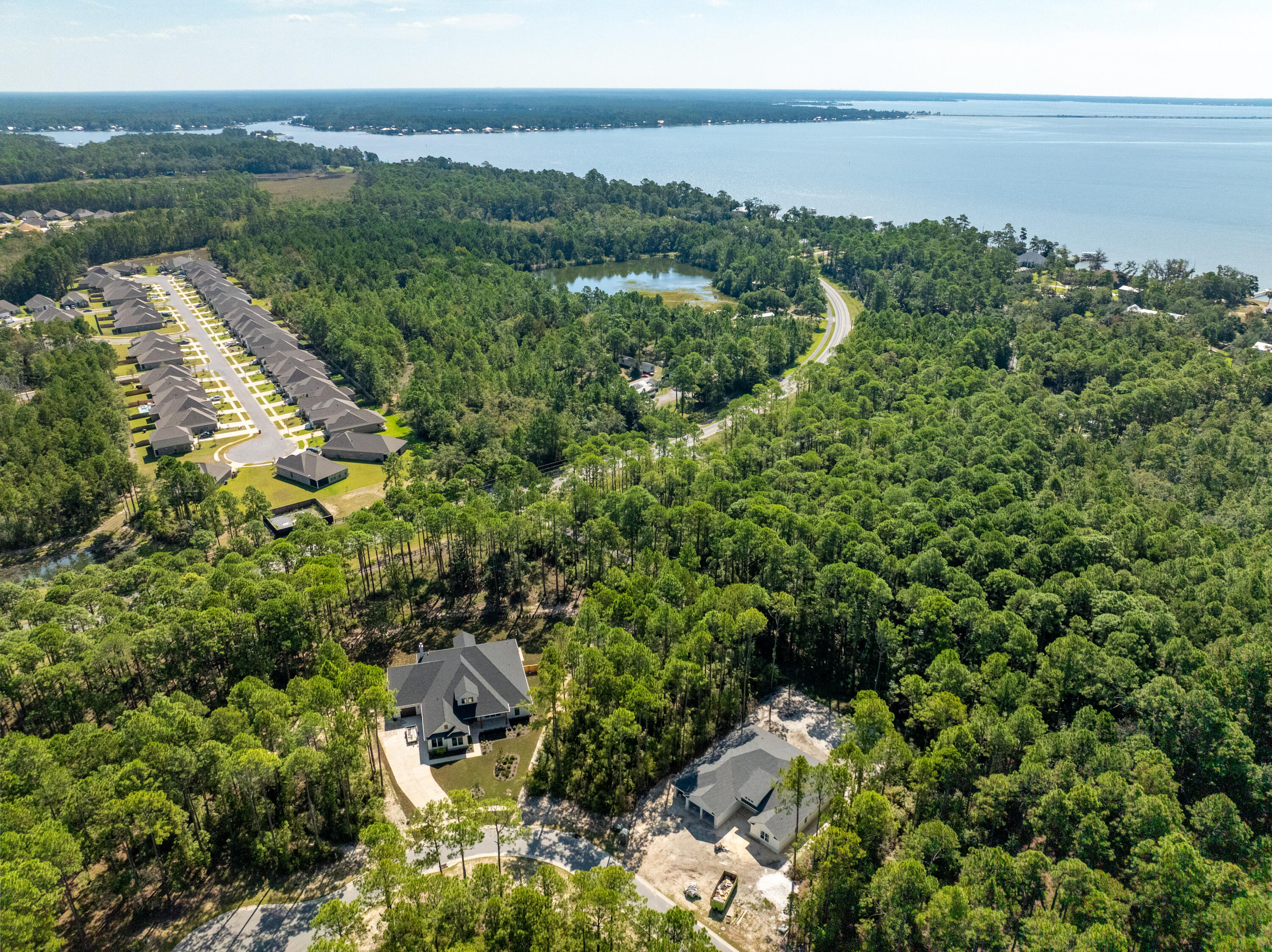 Lot 37 East Captain Fritz Way Freeport, FL 32439 - Photo 22 of 34 an aerial view of a house with a yard and lake view