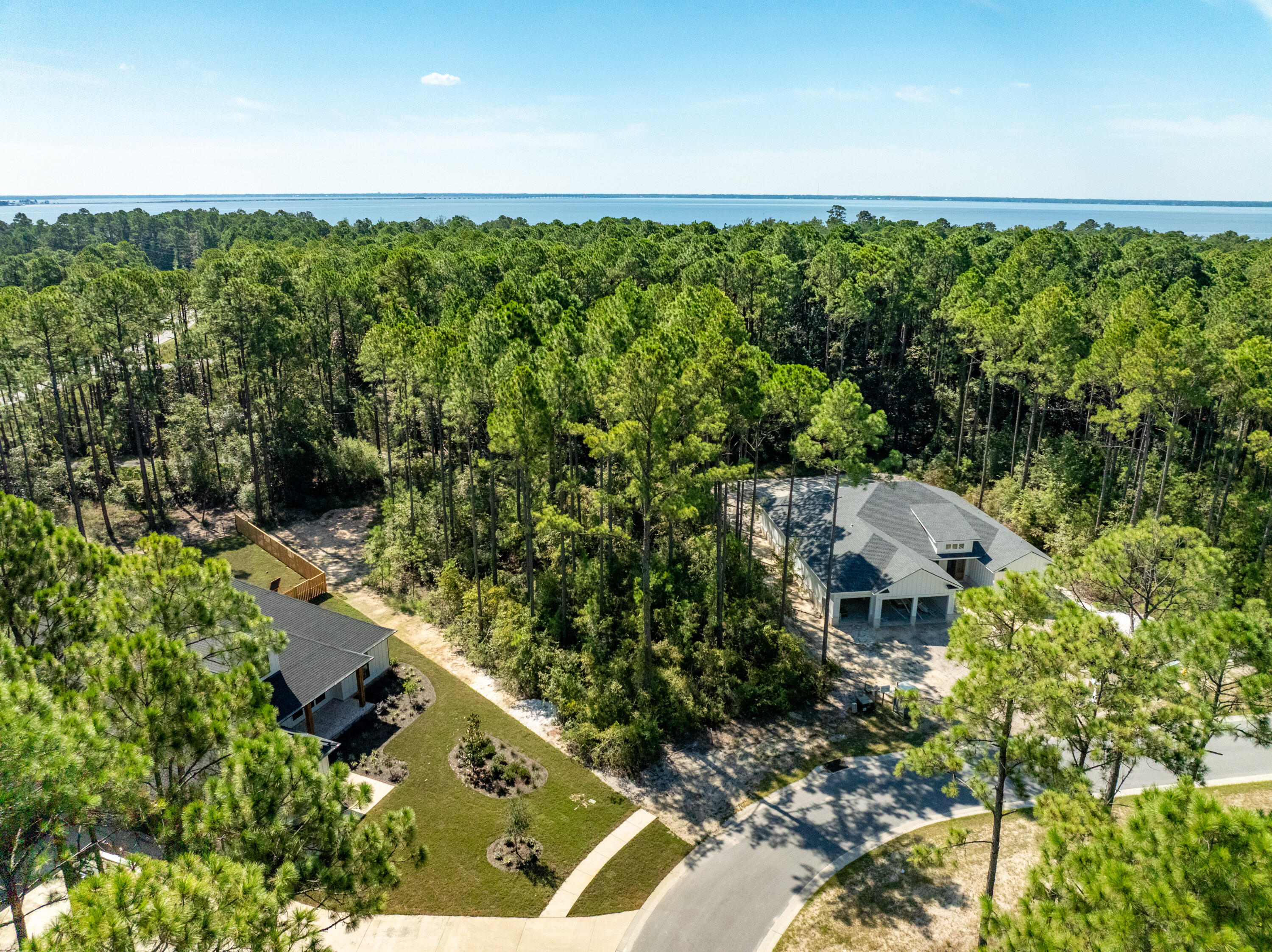 Lot 37 East Captain Fritz Way Freeport, FL 32439 - Photo 31 of 34 an aerial view of residential house with outdoor space and trees in the background