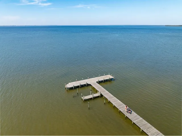 a view of a lake with houses in the back