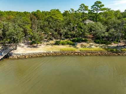 a view of a house with swimming pool and sitting area
