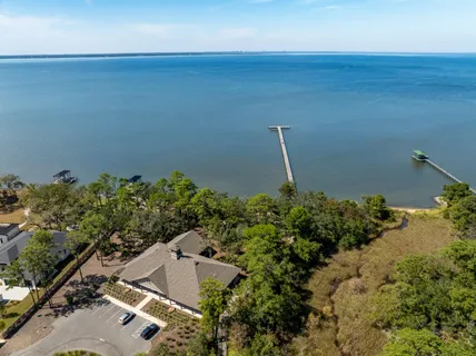 an aerial view of a house with a garden and trees