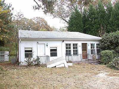 2008 Millbrook Road Raleigh, NC 27612 - Photo 1 of 1 a house with trees in the background