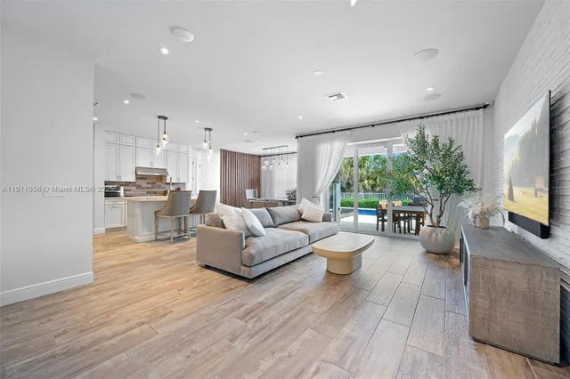 a living room with fireplace furniture and a flat screen tv