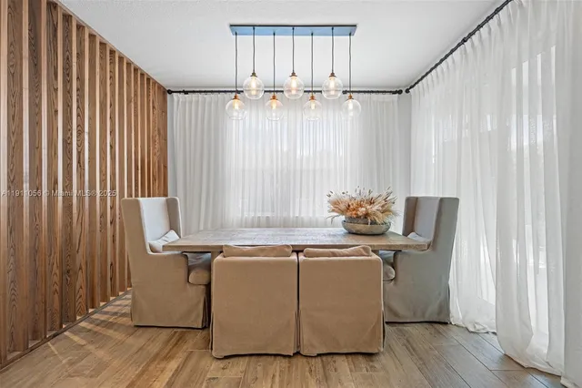 a room with furniture a window and wooden floor