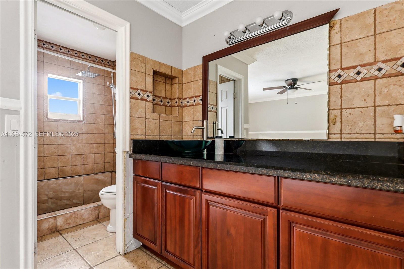 5730 Northwest 199th Street Hialeah, FL 33015 - Photo 16 of 33 a bathroom with a sink and a mirror