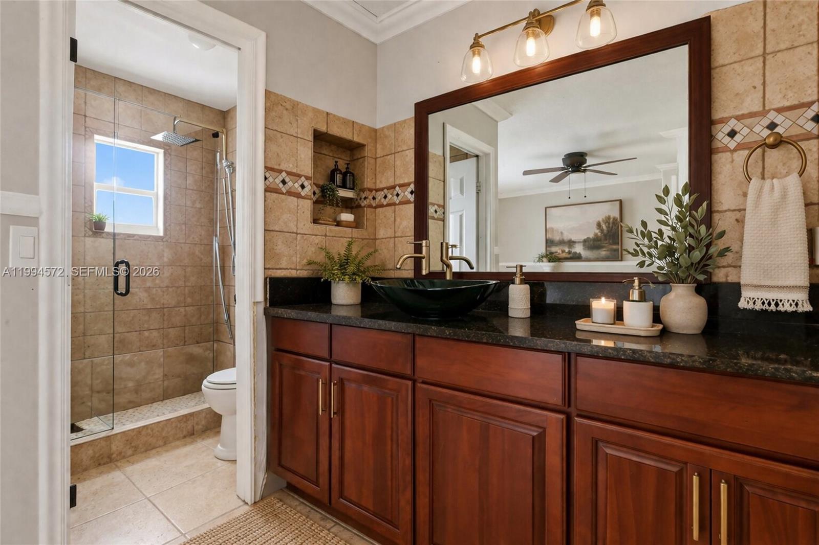 5730 Northwest 199th Street Hialeah, FL 33015 - Photo 17 of 33 a bathroom with a sink and a mirror