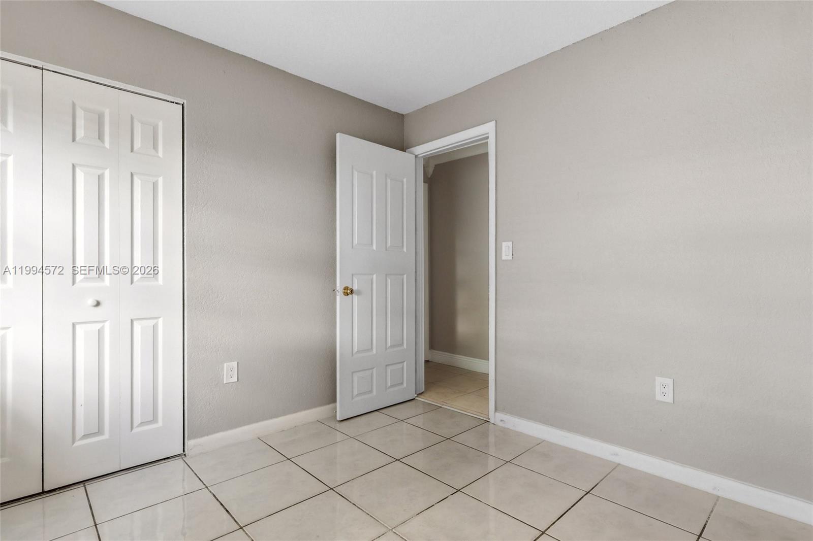 5730 Northwest 199th Street Hialeah, FL 33015 - Photo 19 of 33 an empty room with windows