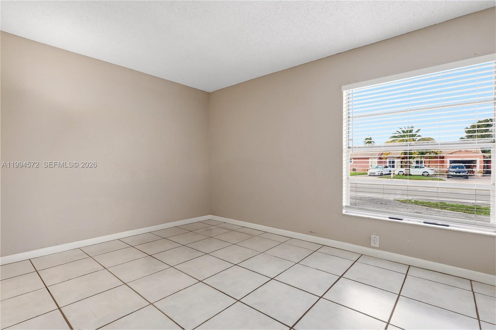 5730 Northwest 199th Street Hialeah, FL 33015 - Photo 20 of 33 a view of an empty room and window