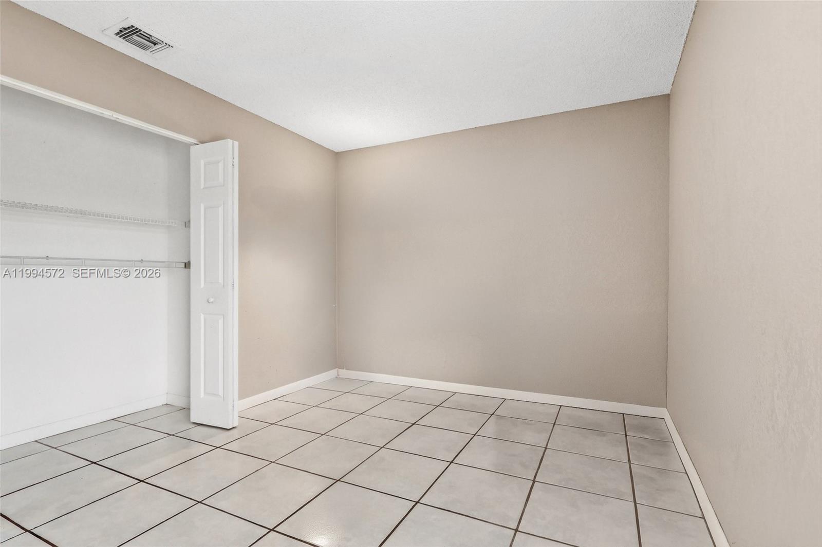 5730 Northwest 199th Street Hialeah, FL 33015 - Photo 21 of 33 a view of an empty room