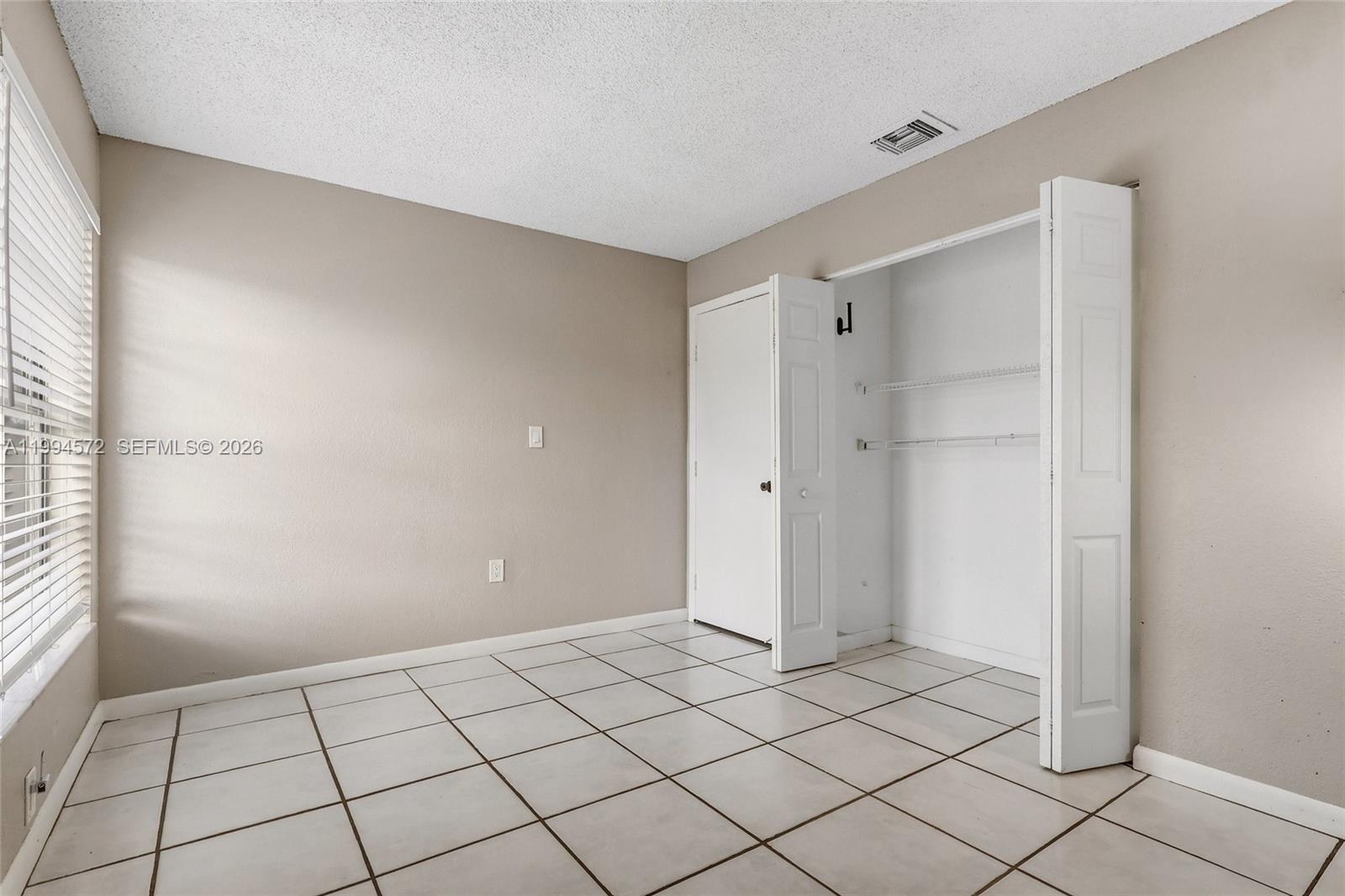 5730 Northwest 199th Street Hialeah, FL 33015 - Photo 23 of 33 a view of an empty room