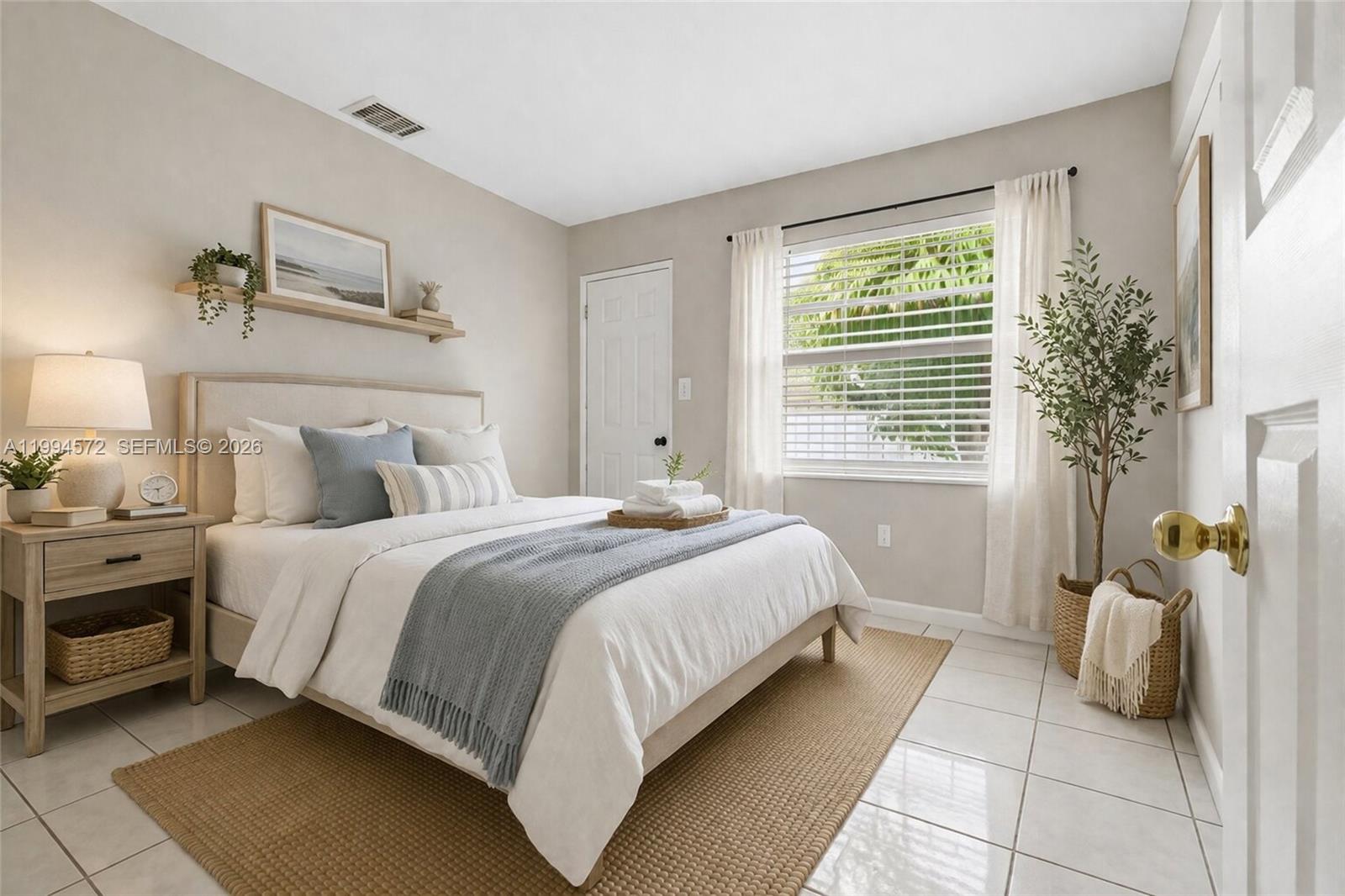 5730 Northwest 199th Street Hialeah, FL 33015 - Photo 24 of 33 a bedroom with a bed and a couch