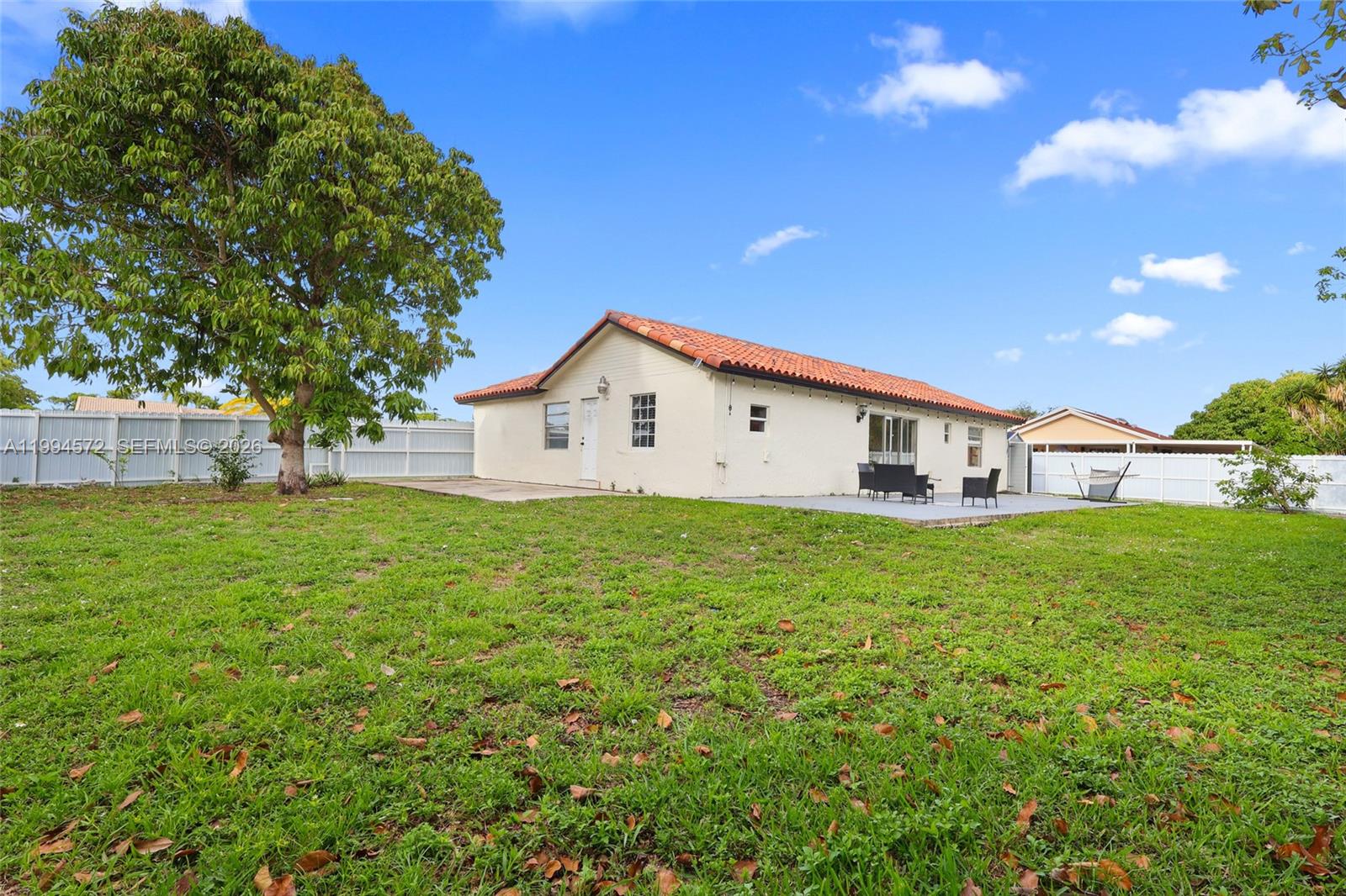 5730 Northwest 199th Street Hialeah, FL 33015 - Photo 28 of 33 a view of a house with backyard