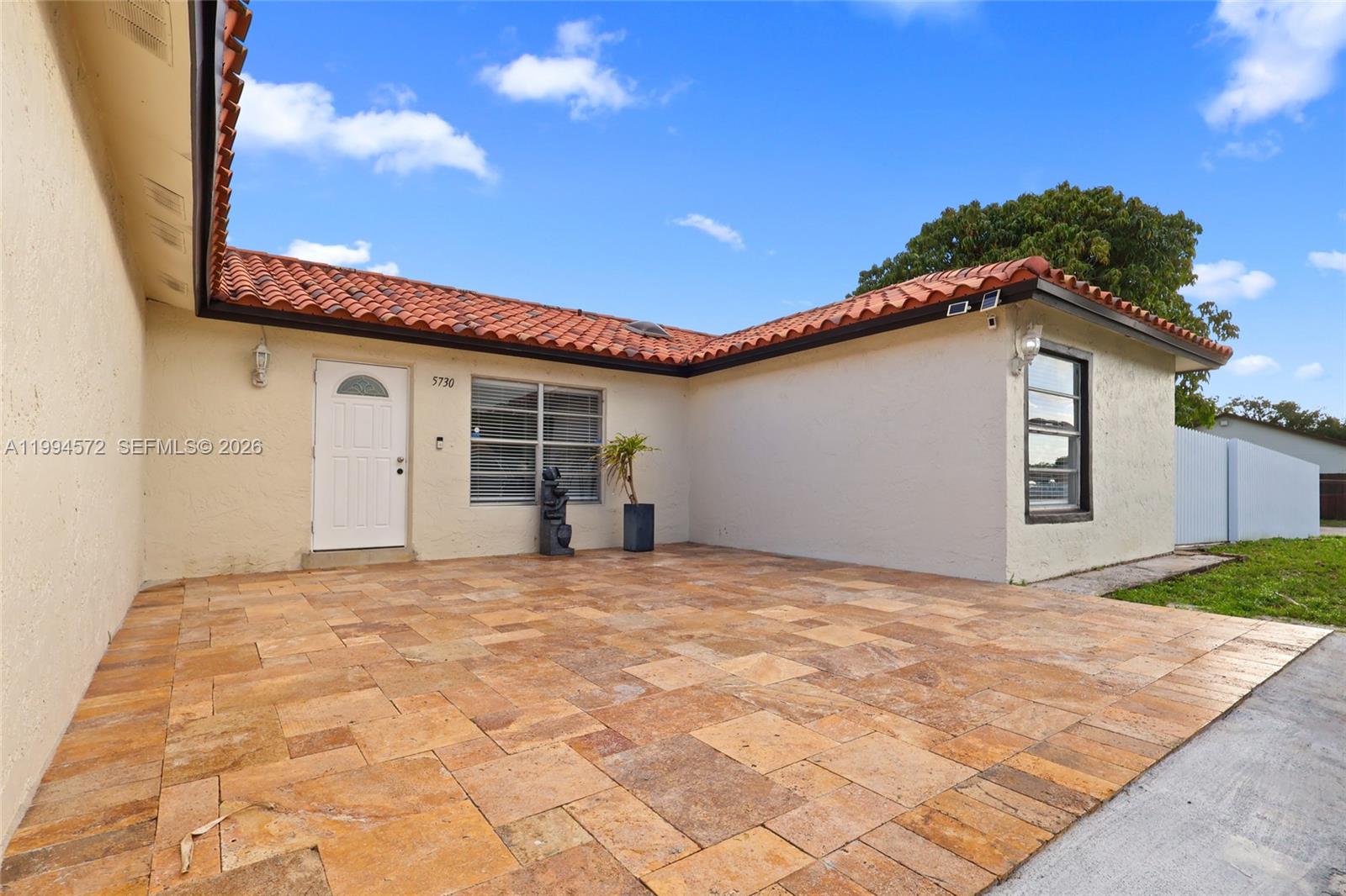 5730 Northwest 199th Street Hialeah, FL 33015 - Photo 3 of 33 a view of a house with a yard