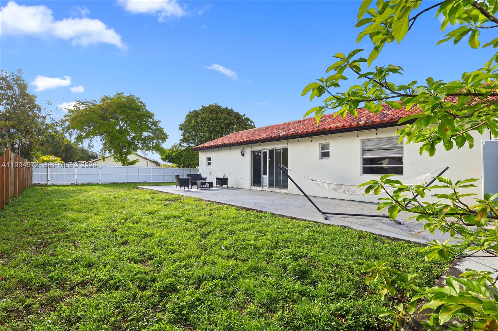 5730 Northwest 199th Street Hialeah, FL 33015 - Photo 31 of 33 a house view with a garden space