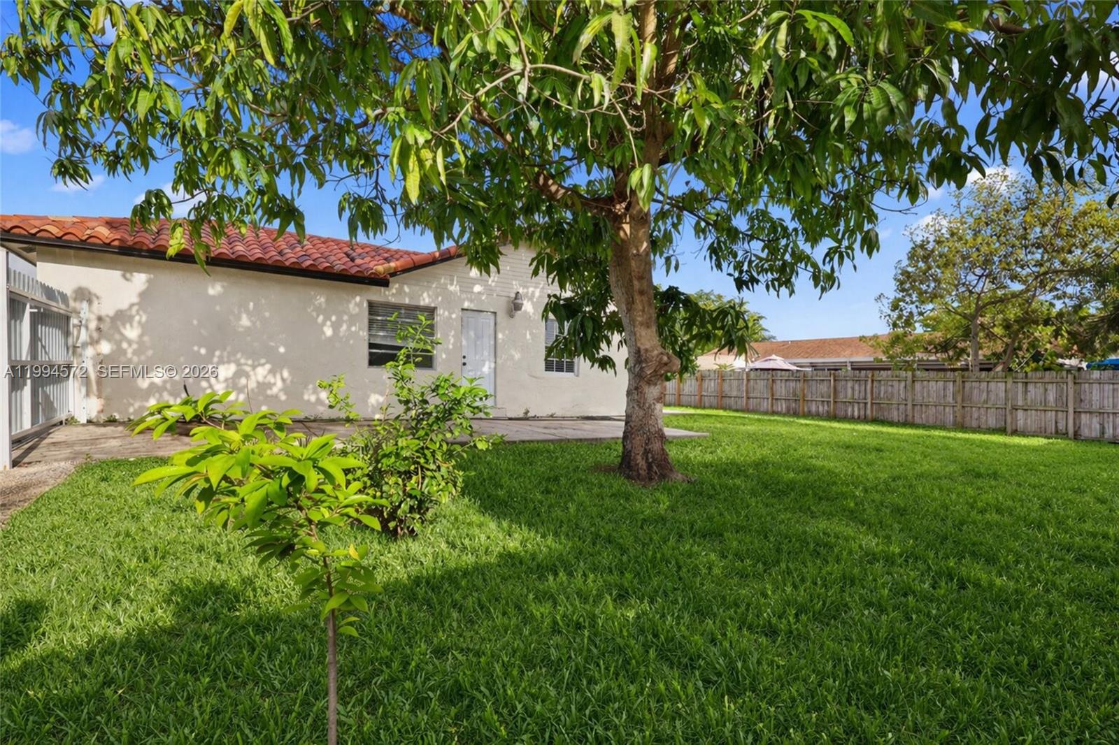 5730 Northwest 199th Street Hialeah, FL 33015 - Photo 33 of 33 a front view of a house with garden
