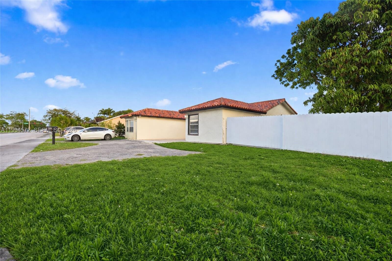 5730 Northwest 199th Street Hialeah, FL 33015 - Photo 4 of 33 a view of a backyard with plants and a garden