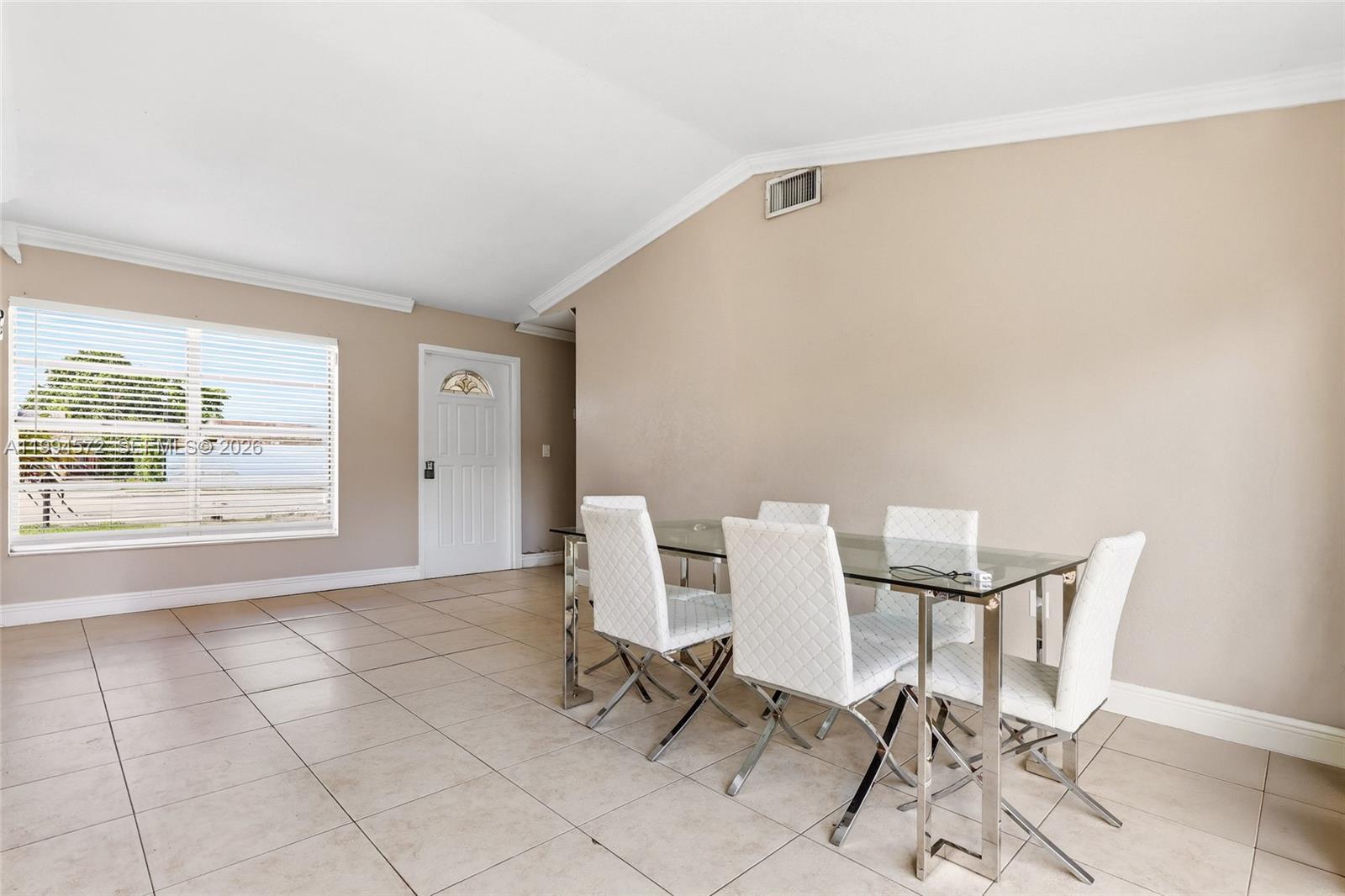 5730 Northwest 199th Street Hialeah, FL 33015 - Photo 5 of 33 a view of a room with furniture and a window