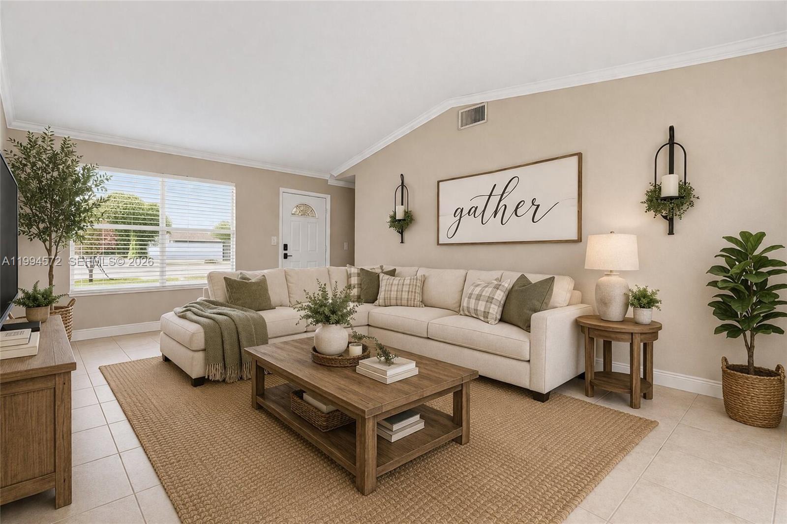 5730 Northwest 199th Street Hialeah, FL 33015 - Photo 6 of 33 a living room with furniture potted plant and kitchen view