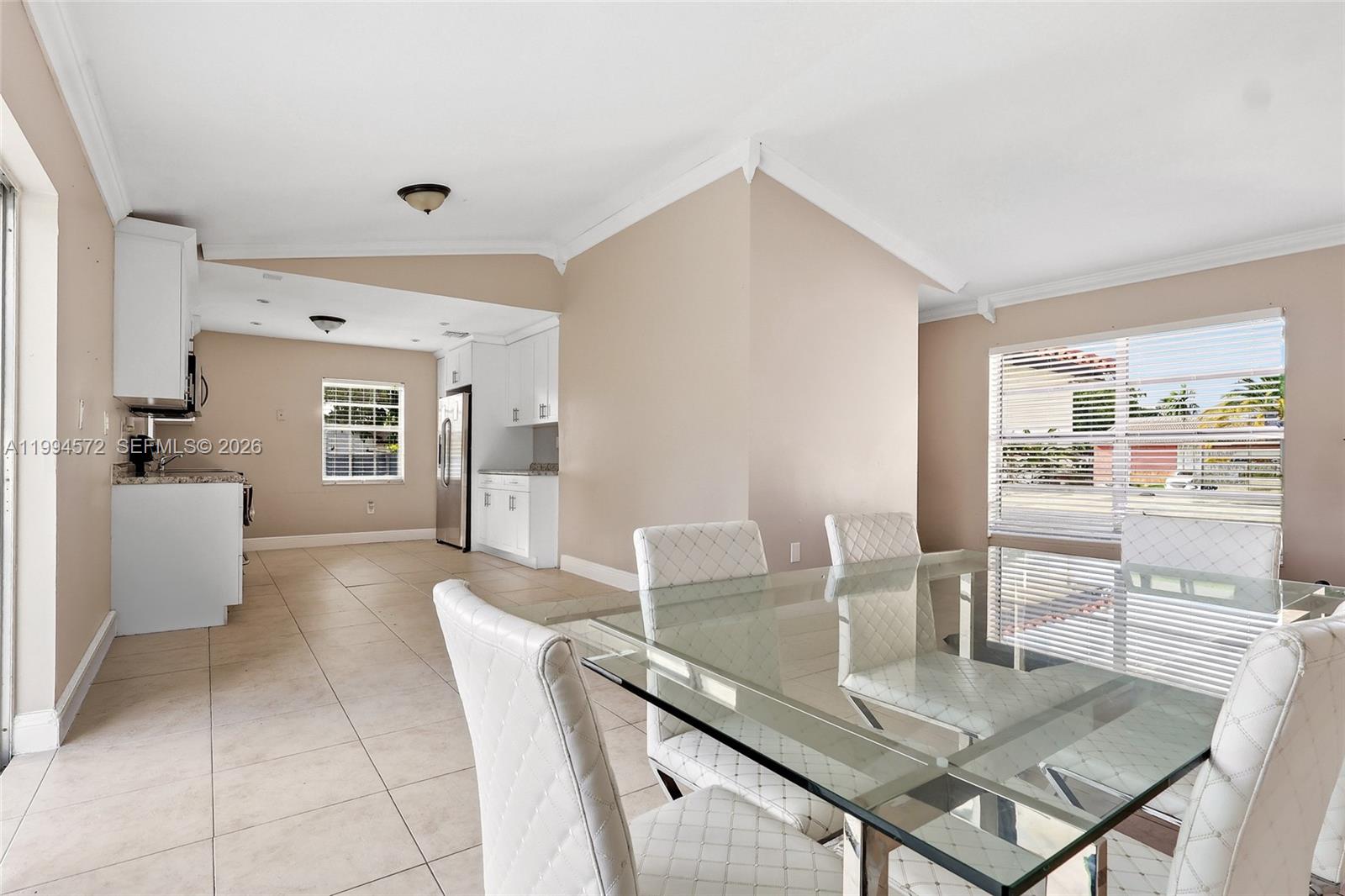 5730 Northwest 199th Street Hialeah, FL 33015 - Photo 7 of 33 a dining room with furniture and window