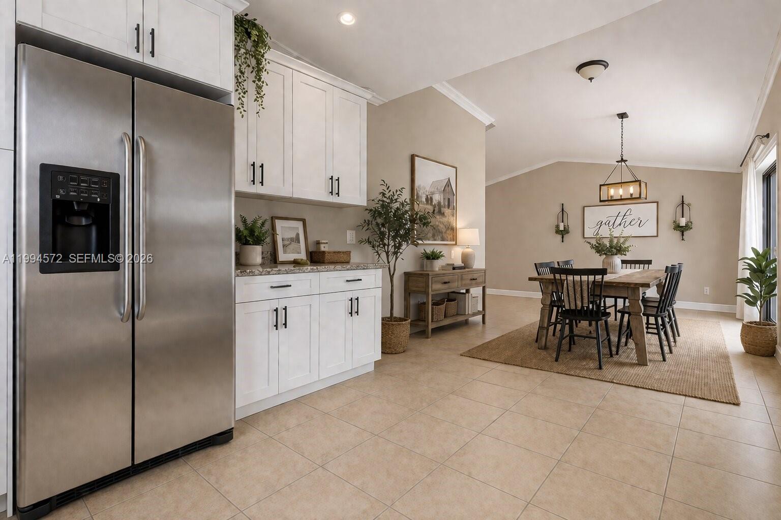 5730 Northwest 199th Street Hialeah, FL 33015 - Photo 10 of 33 a kitchen with stainless steel appliances kitchen island granite countertop a refrigerator a stove a dining table and chairs with wooden floor