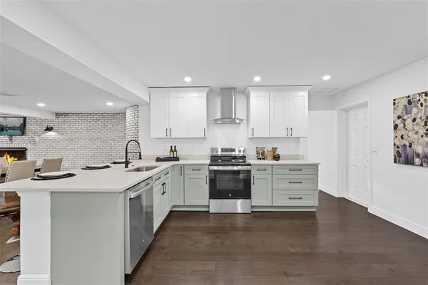 a kitchen with a sink stove and cabinets