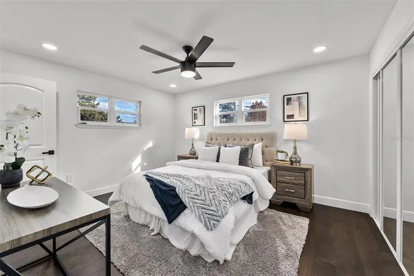 a bedroom with a bed and a table in it