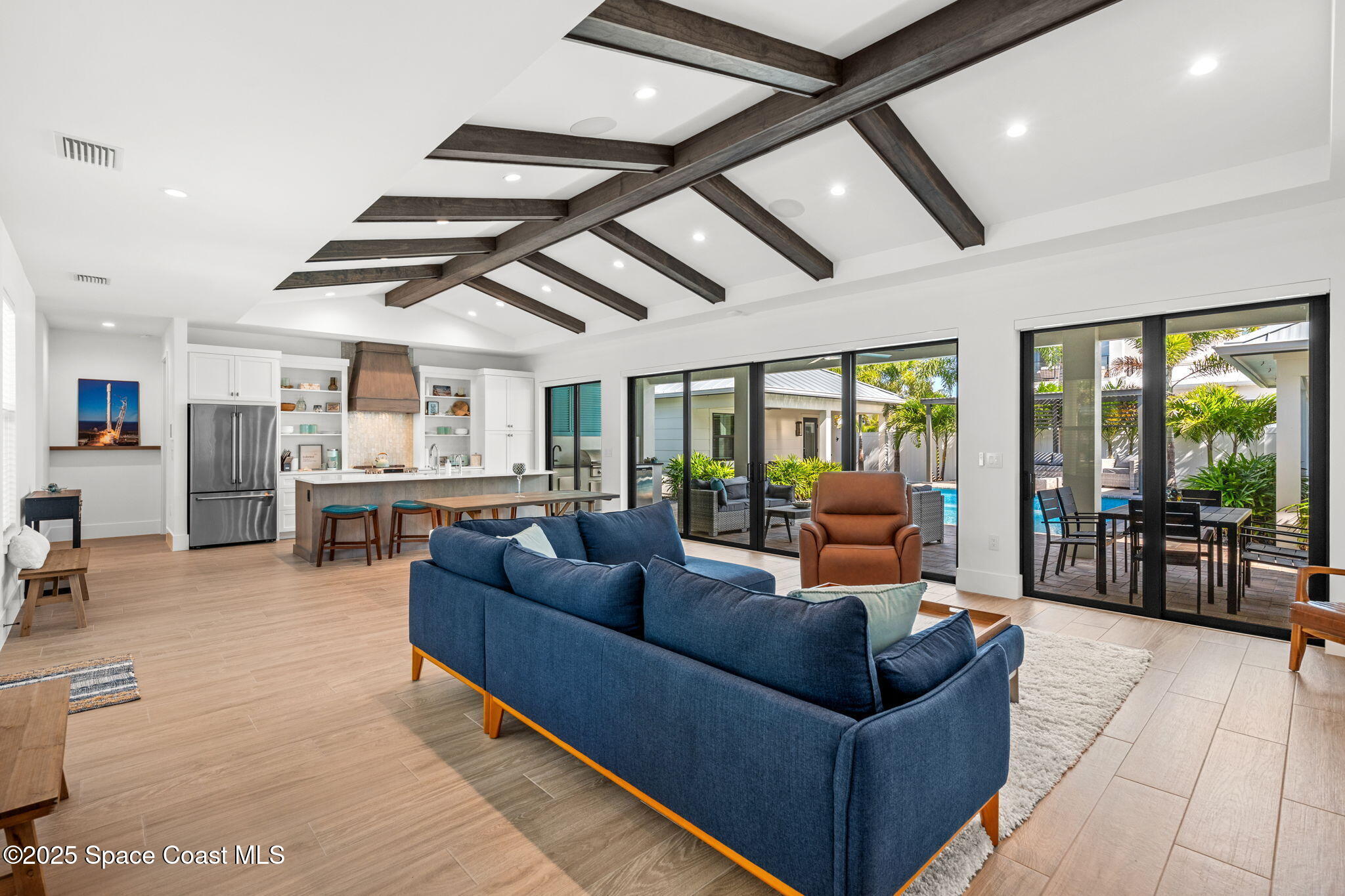 2021 South Orlando Avenue Cocoa Beach, FL 32931 - Photo 12 of 42 a living room with furniture and a table