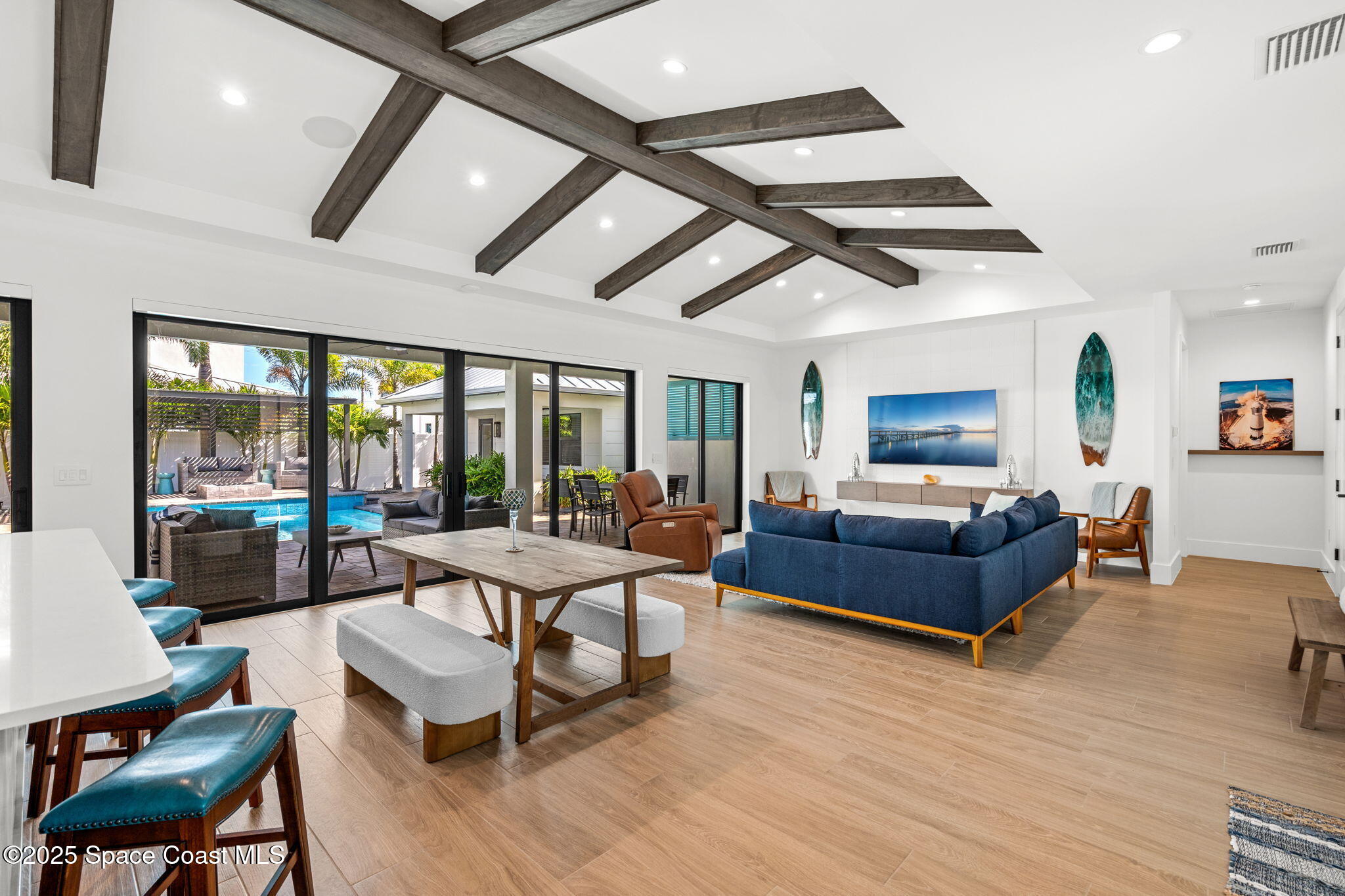 2021 South Orlando Avenue Cocoa Beach, FL 32931 - Photo 13 of 42 a living room with furniture and a large window