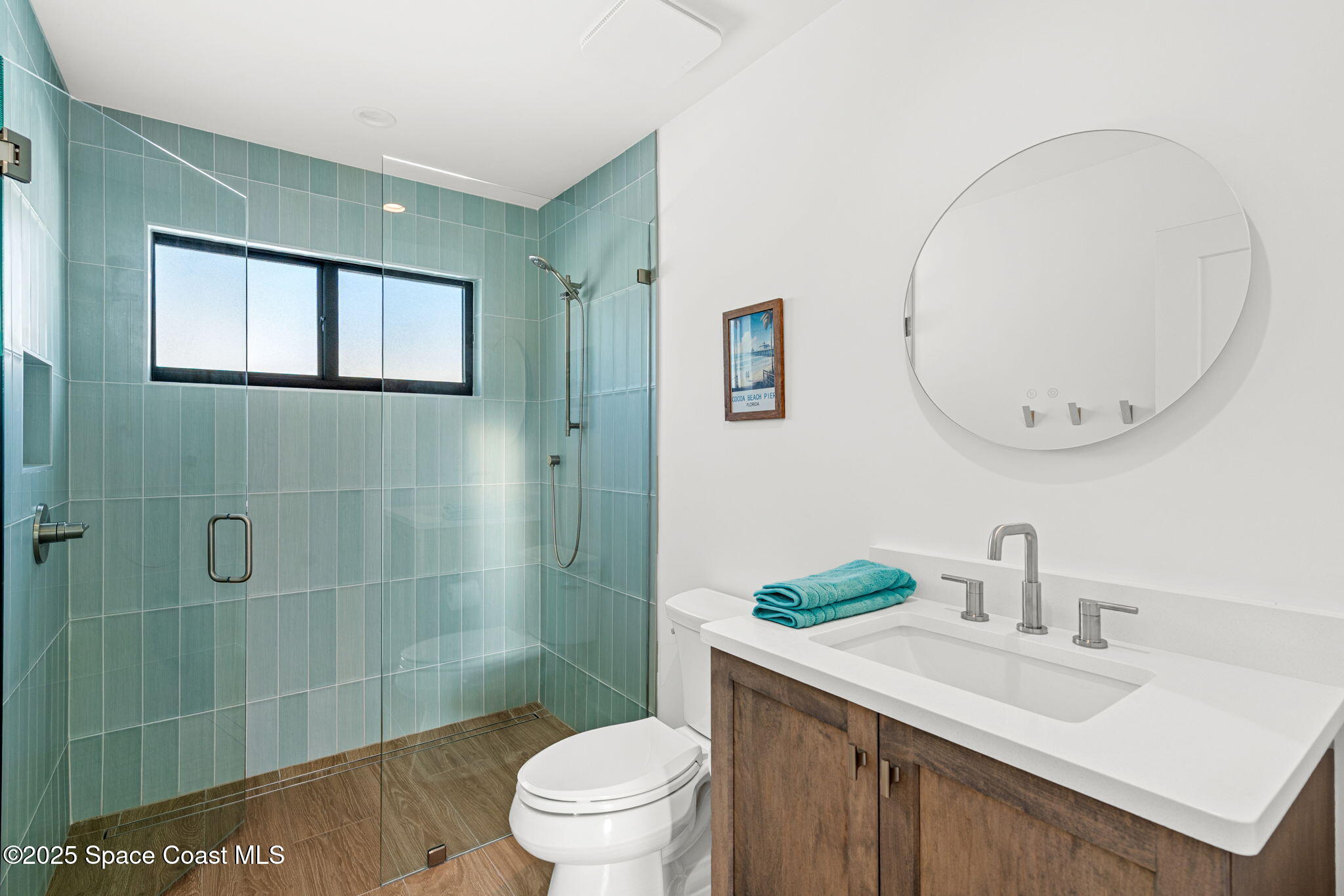 2021 South Orlando Avenue Cocoa Beach, FL 32931 - Photo 16 of 42 a bathroom with a sink a toilet and shower