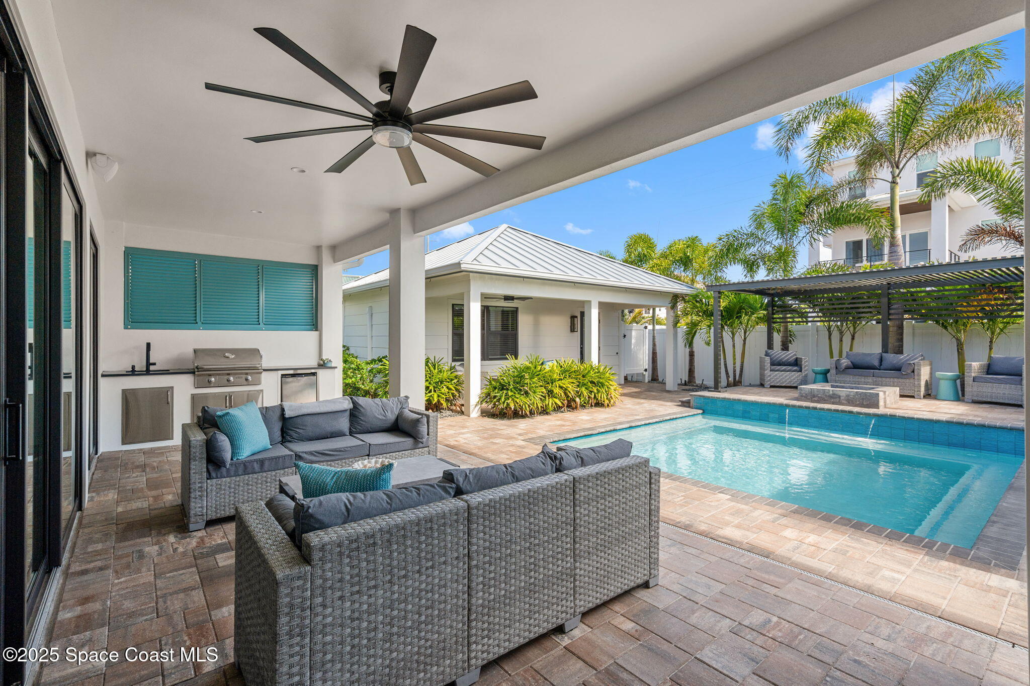 2021 South Orlando Avenue Cocoa Beach, FL 32931 - Photo 19 of 42 a living room with furniture and a large window