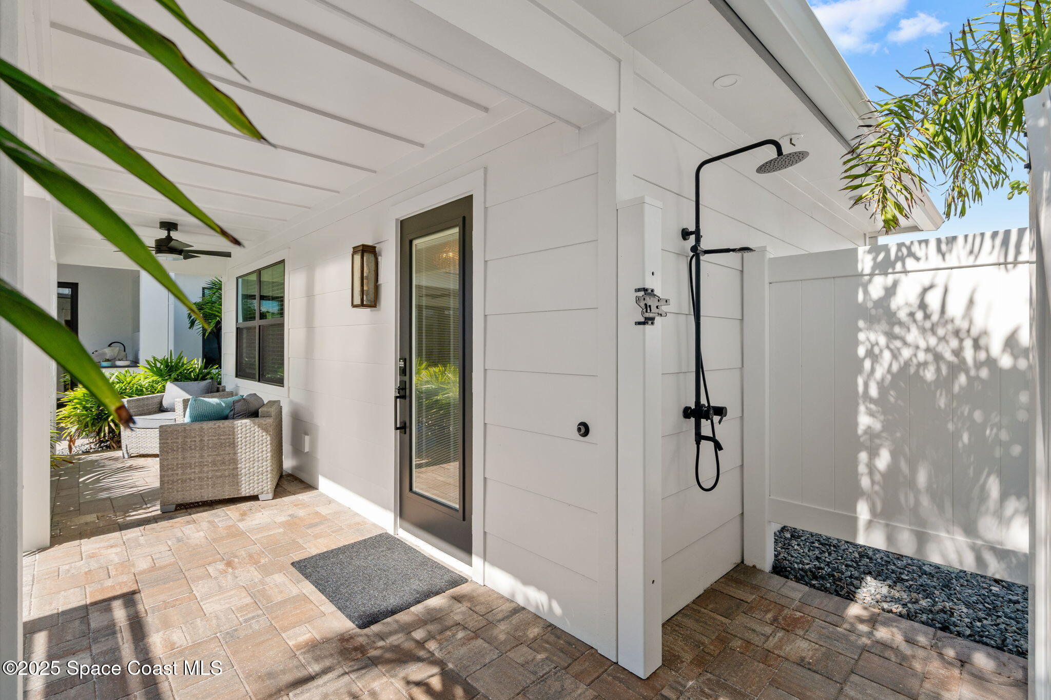 2021 South Orlando Avenue Cocoa Beach, FL 32931 - Photo 25 of 42 a view of a hallway with outdoor seating