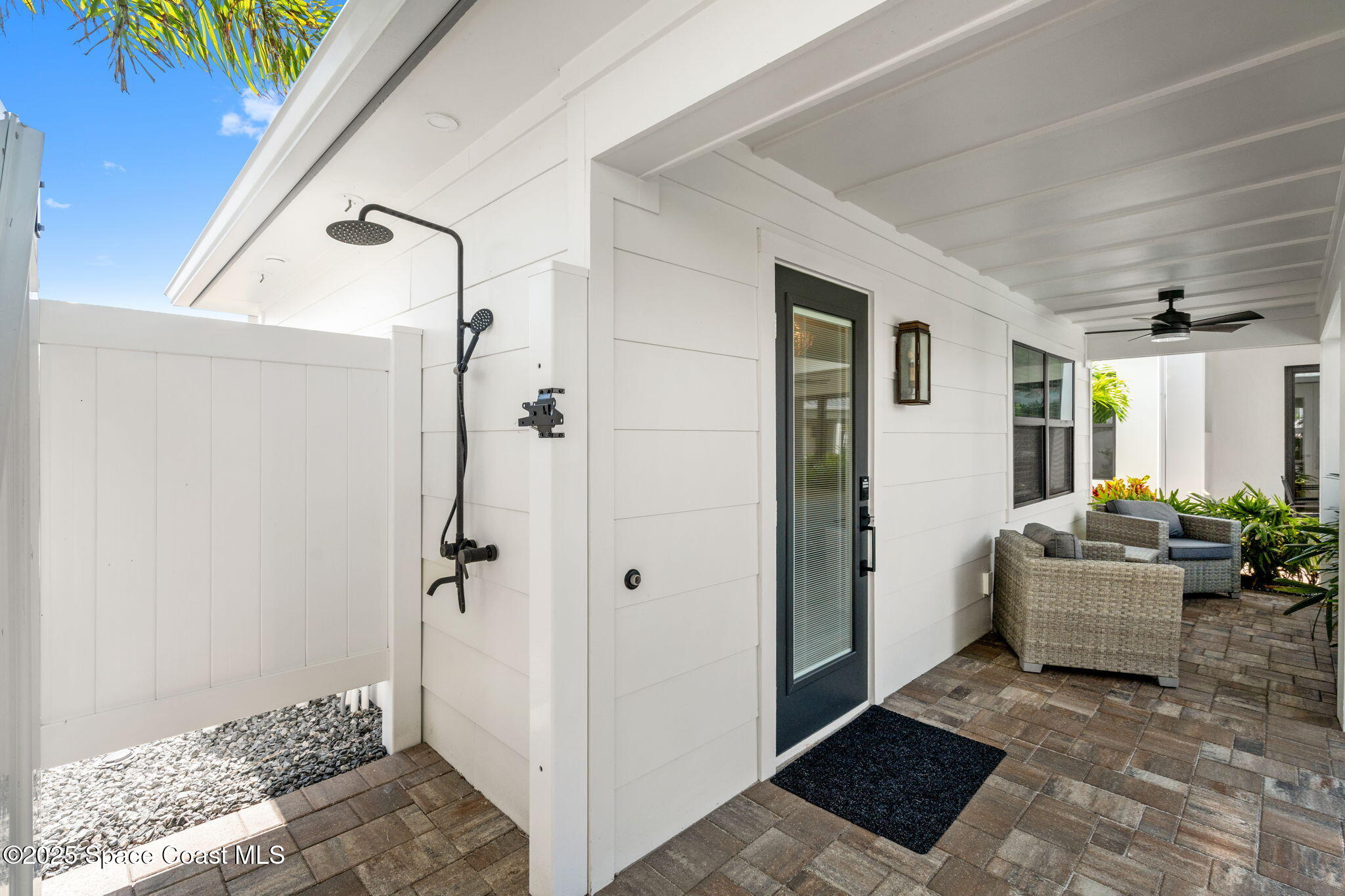 2021 South Orlando Avenue Cocoa Beach, FL 32931 - Photo 26 of 42 a view of a hallway to a livingroom with furniture and windows