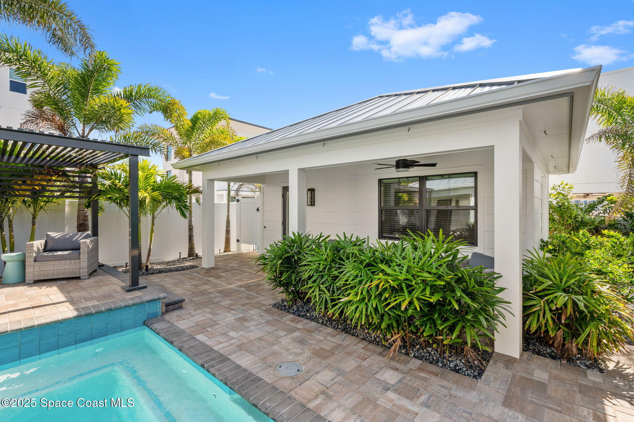 2021 South Orlando Avenue Cocoa Beach, FL 32931 - Photo 27 of 42 a front view of a house with garden