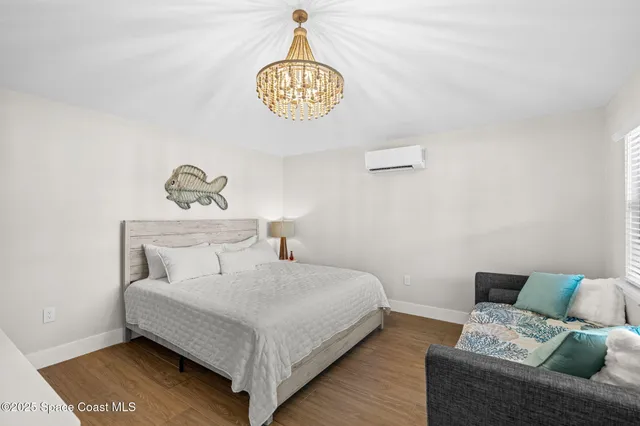 a bedroom with a bed and a table