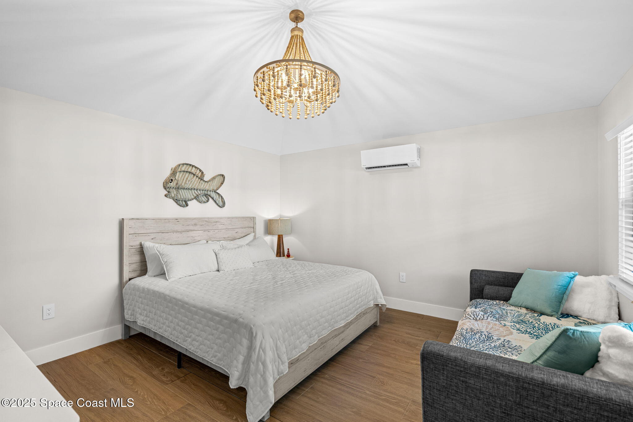 2021 South Orlando Avenue Cocoa Beach, FL 32931 - Photo 28 of 42 a bedroom with a bed and a table