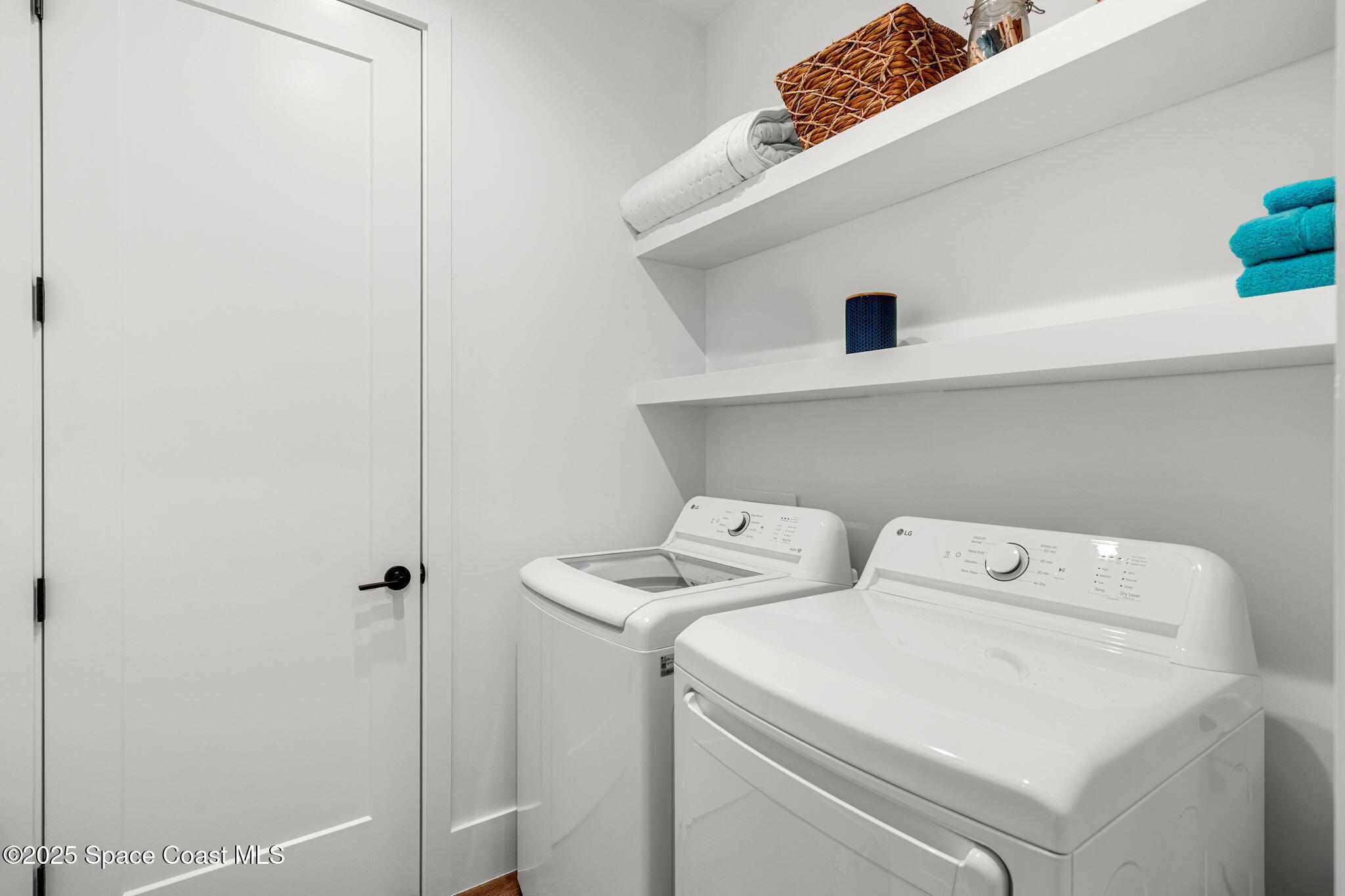 2021 South Orlando Avenue Cocoa Beach, FL 32931 - Photo 31 of 42 a utility room with dryer and washer