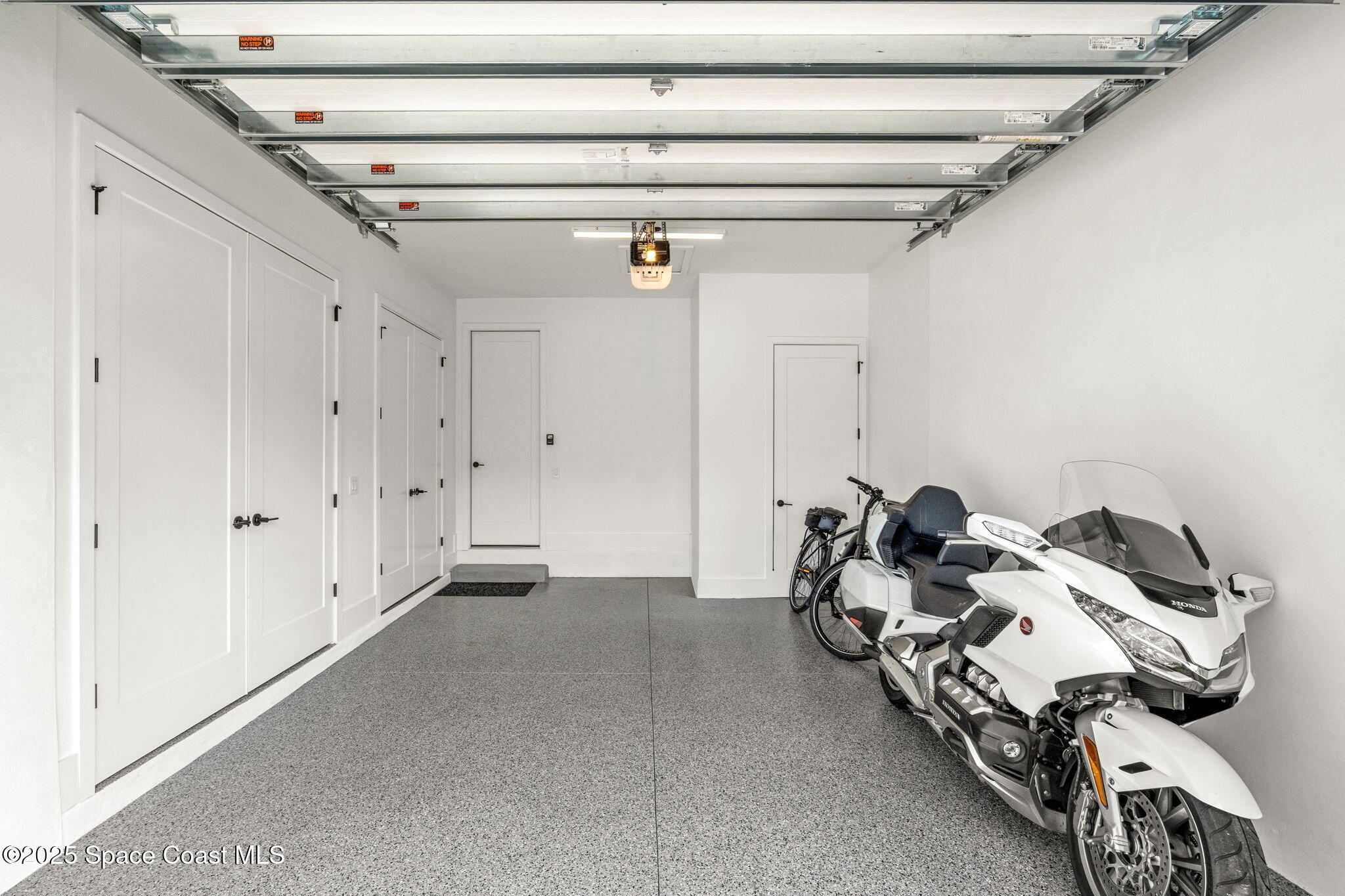 2021 South Orlando Avenue Cocoa Beach, FL 32931 - Photo 33 of 42 a bed room with a bed and a window