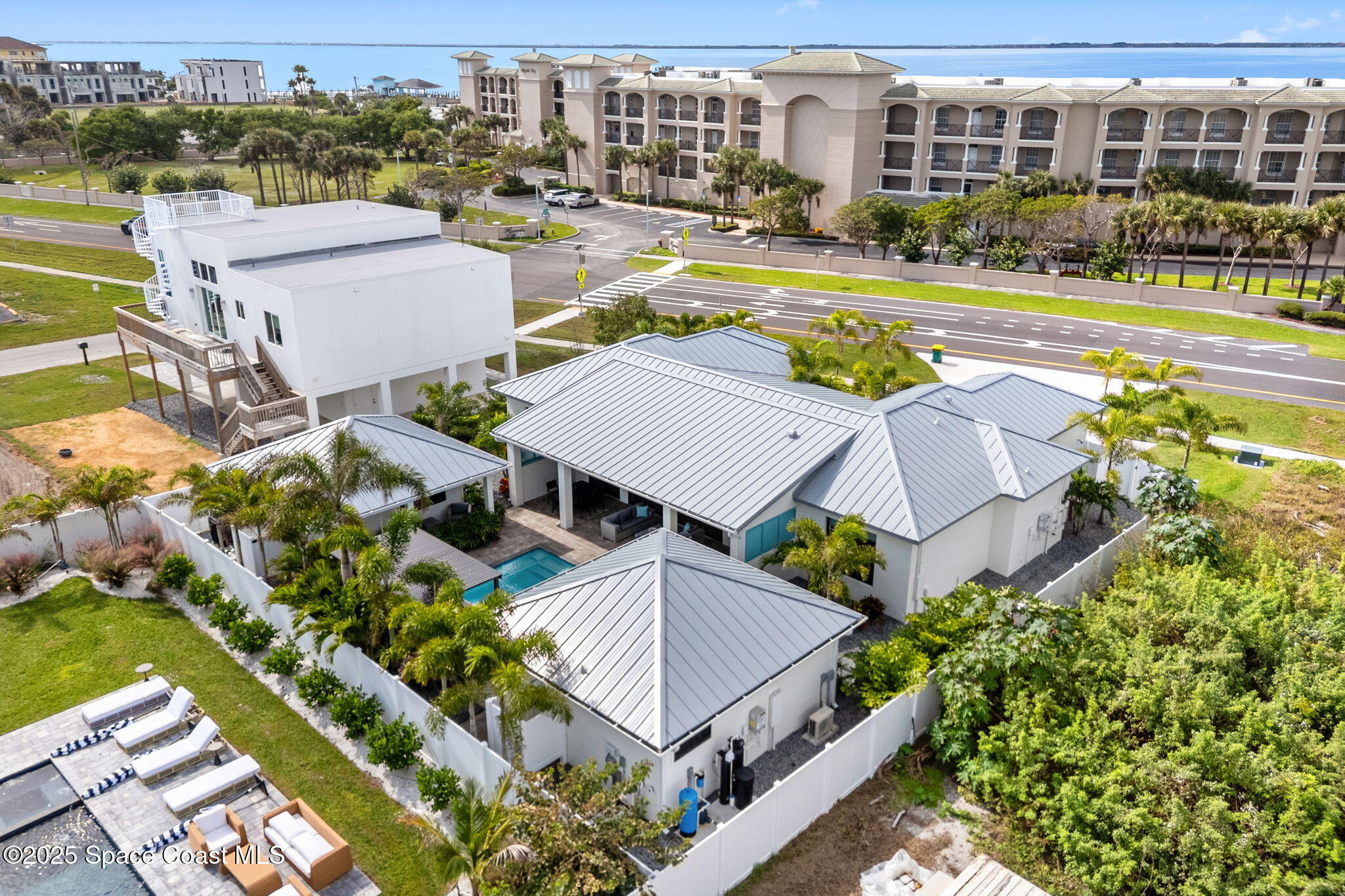 2021 South Orlando Avenue Cocoa Beach, FL 32931 - Photo 34 of 42 an aerial view of residential houses with yard and swimming pool