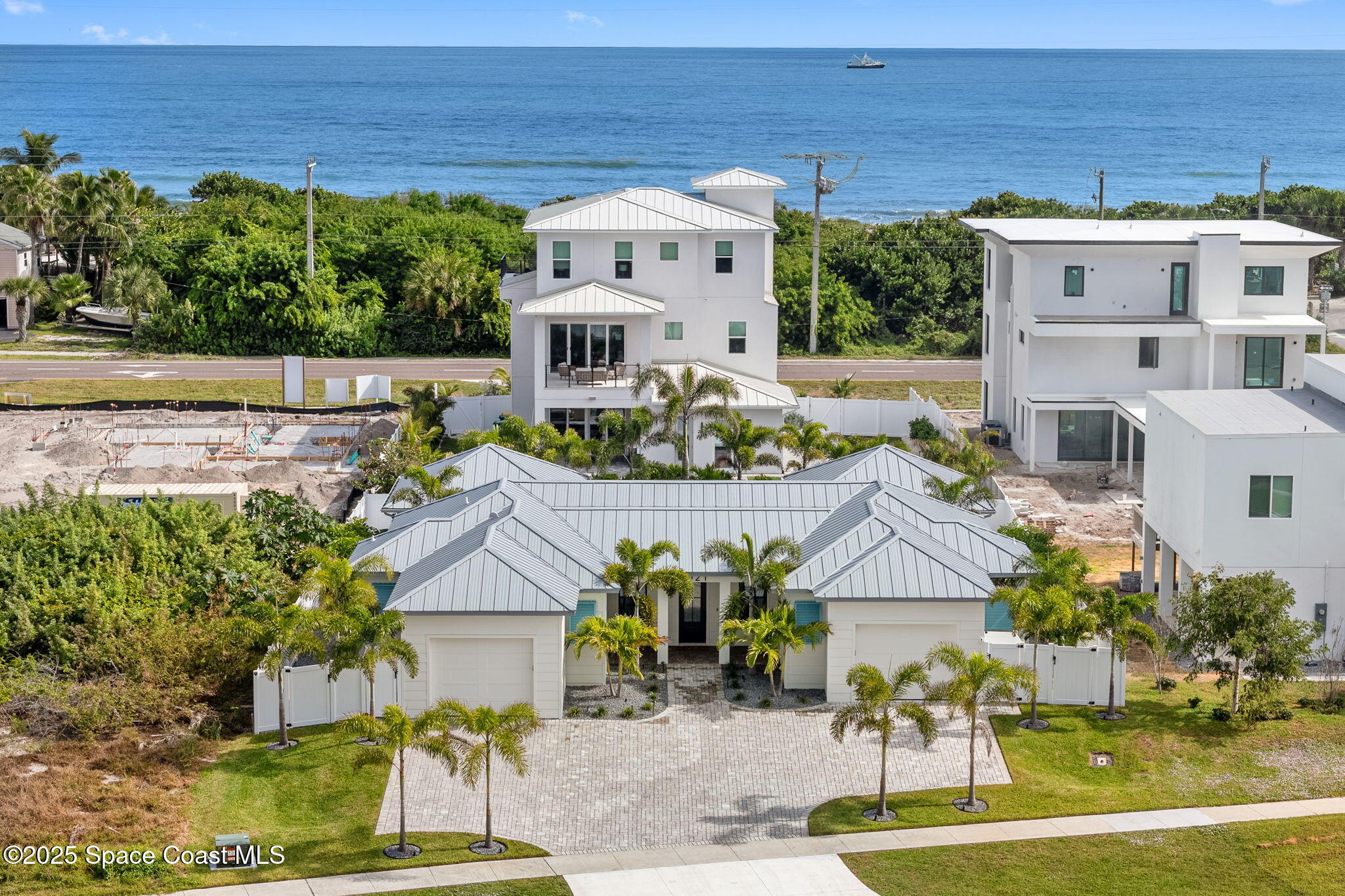 2021 South Orlando Avenue Cocoa Beach, FL 32931 - Photo 38 of 42 a view of multiple houses with a yard